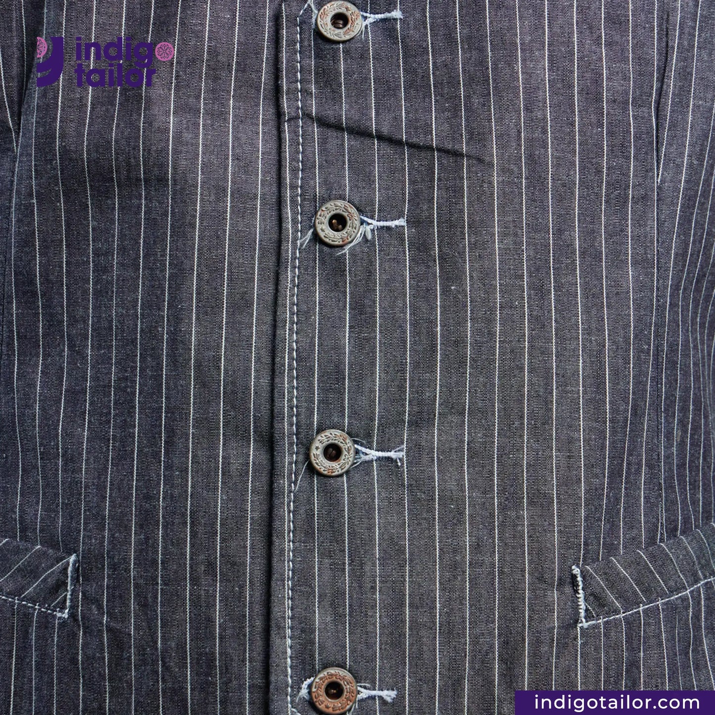 Close-up of a INDIGO VINTAGE STRIPE WORK VEST with white pinstripes and buttons, featuring the brand 'Indigotailor'.