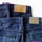 Blue jeans with brown leather patches on a white background, featuring 'indigo tailor' branding.