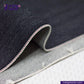 Close-up of IRONMAN HEAVYWEIGHT SELVEDGE DENIM fabric with visible stitching on a textured surface, featuring the Indigo Tailor logo.