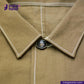 Close-up of a KHAKI HERRINGBONE COVERALL JACKET collar with a button, featuring 'indig tailor' branding.