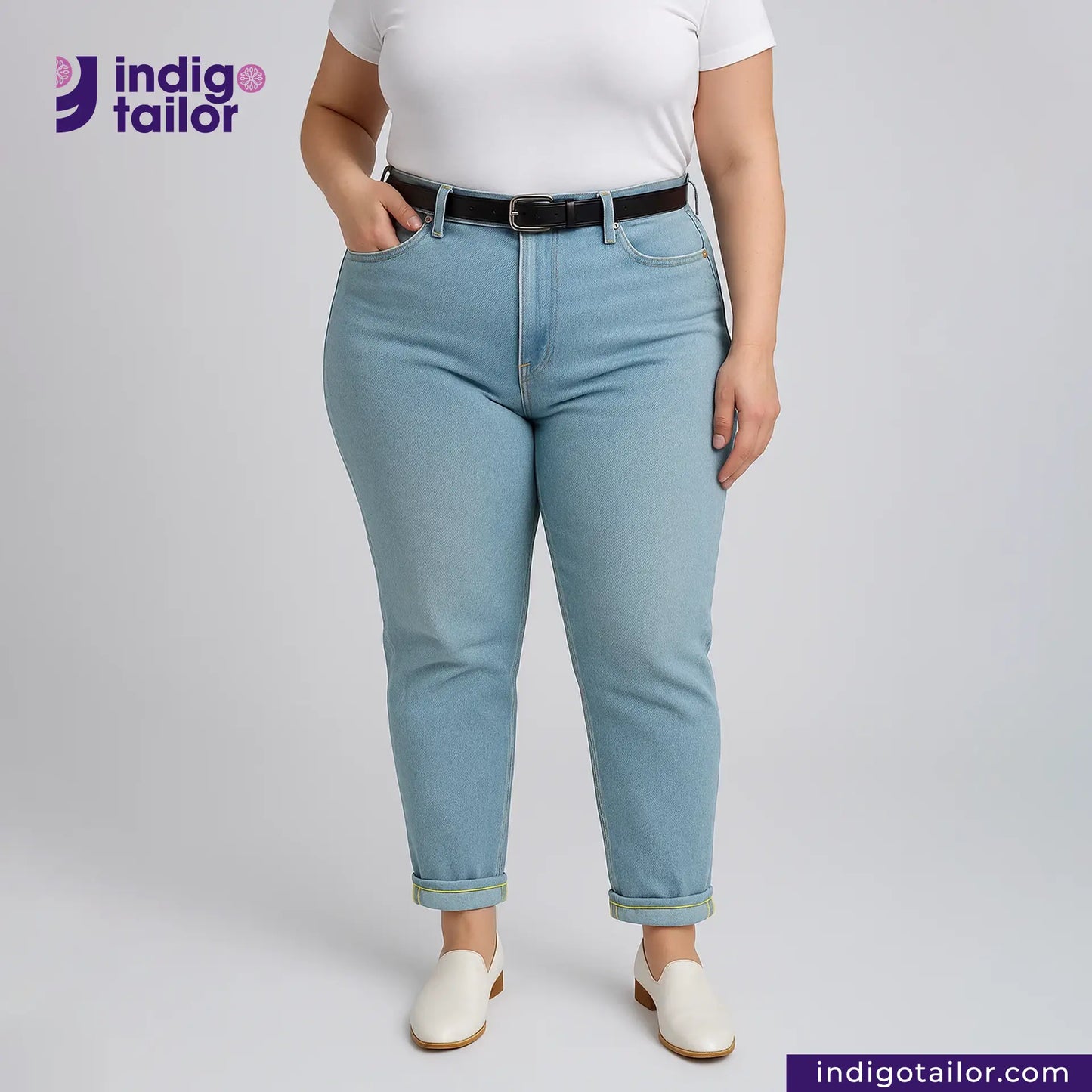 Person wearing LIGHT WASHED SELVEDGE DENIM LIME SELVEDGE jeans and a white shirt with 'Indigotailor' branding.