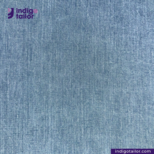 Close-up of LIGHT WASHED SELVEDGE DENIM LIME SELVEDGE ID fabric with 'Indigotailor' logo and website URL.
