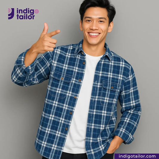 Man wearing a MADRAS SPRING BLUE  WHITE CHECK shirt giving a thumbs up against a gray background with 'Indigotailor' branding.