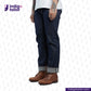 Person wearing MEDIUM BLUE DENIM LIVIDUS SELVEDGE jeans and brown boots with 'Indigo Tailor' logo and website URL.