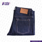 Folded MEDIUM BLUE DENIM LIVIDUS SELVEDGE jeans with a brown leather patch on a light gray background, featuring the Indigotailor logo.