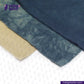 Close-up of NATURAL INDIGO DYED SUEDE with beige border on a white background, featuring 'indigotailor' branding.