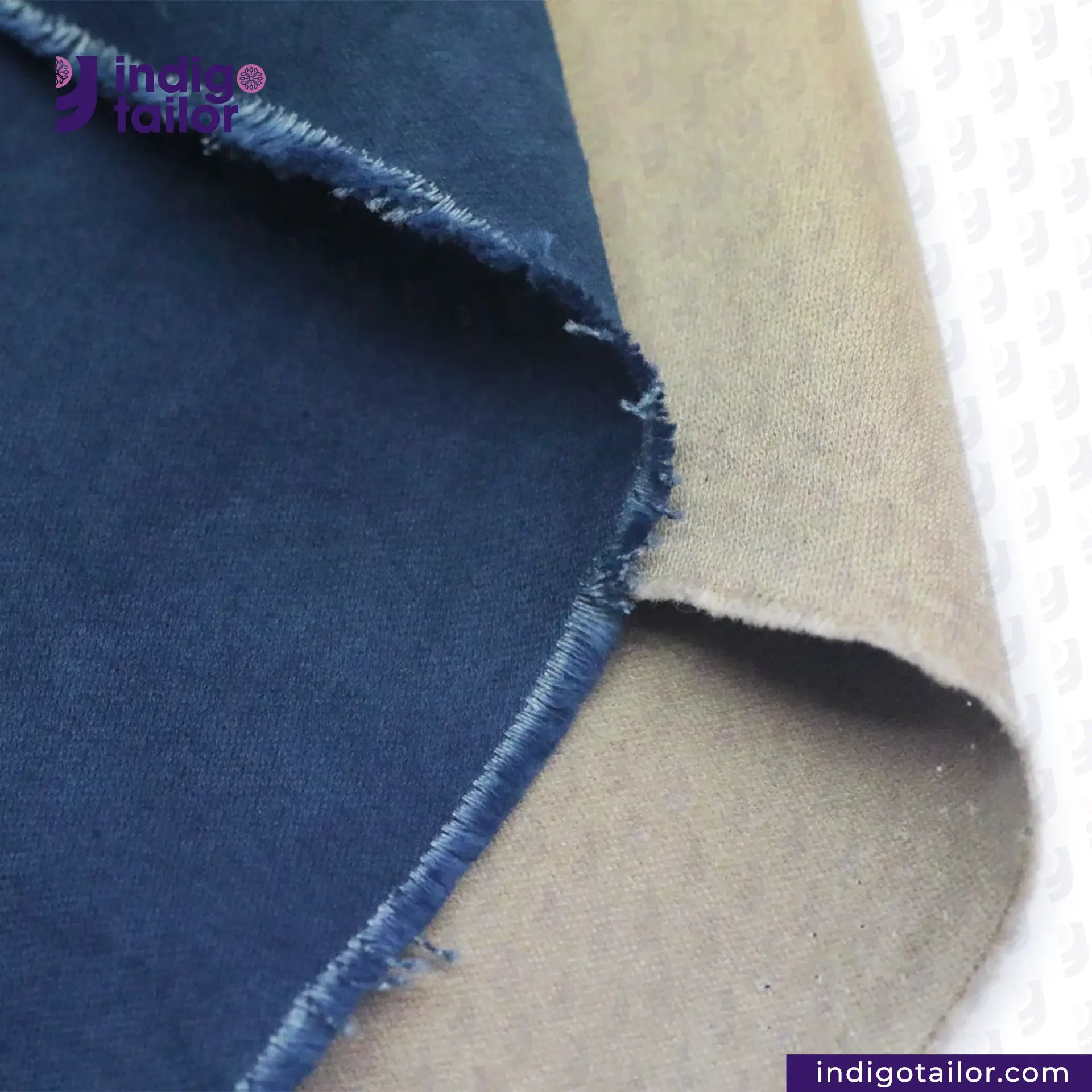 Close-up of NATURAL INDIGO DYED SUEDE fabric with 'Indigo Tailor' branding.