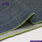 Close-up of OCEAN BLUE COTTON HEMP BLEND SELVEDGE DENIM fabric with green edge, featuring 'indigotailor' brand.