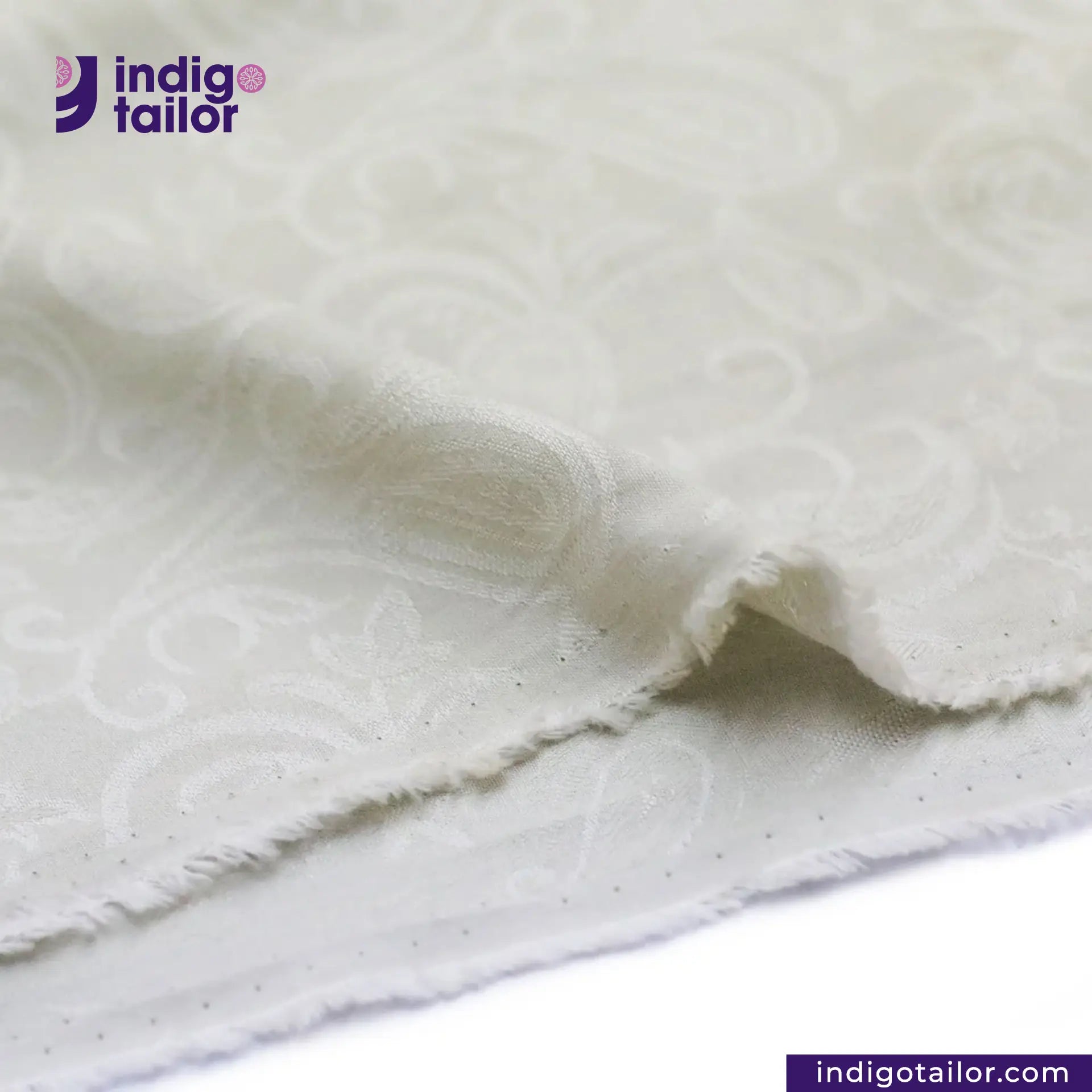 Close-up of OFF-WHITE PAISLEY JACQUARD fabric with 'indigotailor' logo and website.