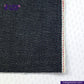 Close-up of ORGANIC NATURAL COTTON SELVEDGE DENIM fabric with a visible brand logo on a white background