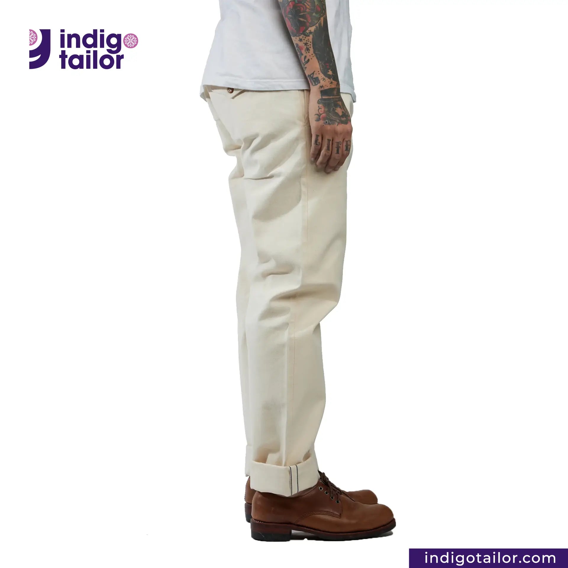 Person wearing Officer Trousers (Off-White) pants with a visible brand logo on a white background