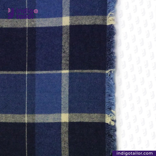 Close-up of PLAID FLANNEL DEEP INDIGO NAVY/BEIGE fabric with a brand logo in the corner.