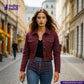 Woman wearing a RED SASHIKO jacket and blue jeans on a city street with 'indigotailor' branding.