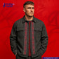 Man wearing a ROUGH-SPUN DENIM FUZZY HANDFEEL jacket with red patterned details on a red background, featuring the Indigotailor logo.