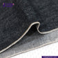 Close-up of ROUGH-SPUN DENIM FUZZY HANDFEEL fabric with visible stitching, featuring the Indigo Tailor logo.