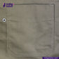 Close-up of a pocket on a SHERPA LINED WAXED CANVAS TRUCKER JACKET with 'Indigotailor' branding.