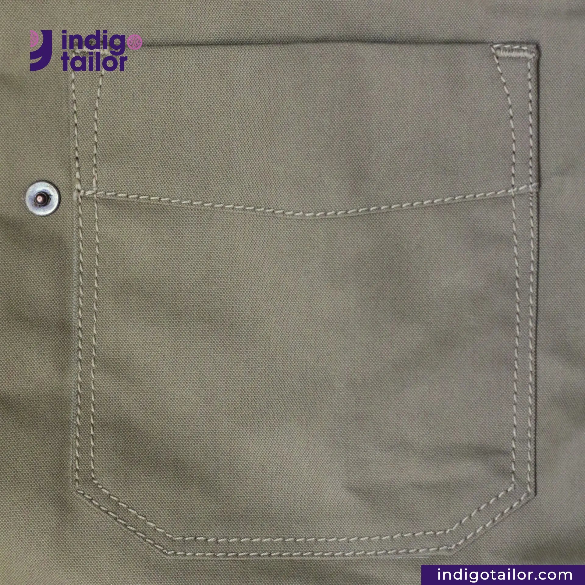 Close-up of a pocket on a SHERPA LINED WAXED CANVAS TRUCKER JACKET with 'Indigotailor' branding.
