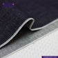 Close-up of SLUBBY INDIGO SELVEDGE DENIM fabric with 'Indigotailor' branding.