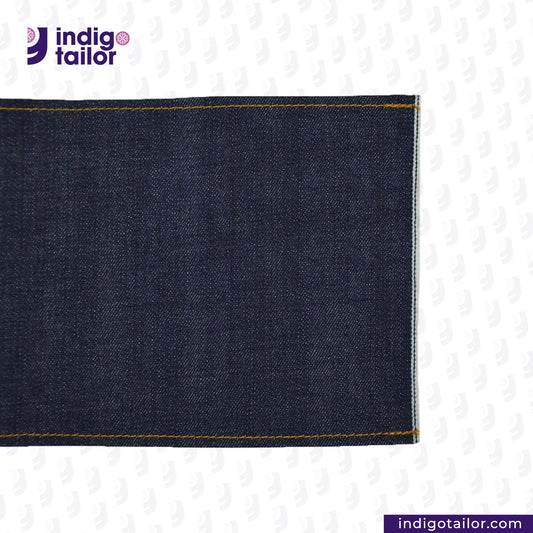 Close-up of SLUBBY INDIGO SELVEDGE DENIM fabric with 'Indigotailor' 