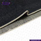 Close-up of SNOWY NEPPY WHITE SELVEDGE DENIM fabric with a herringbone pattern, featuring the Indigo Tailor logo.