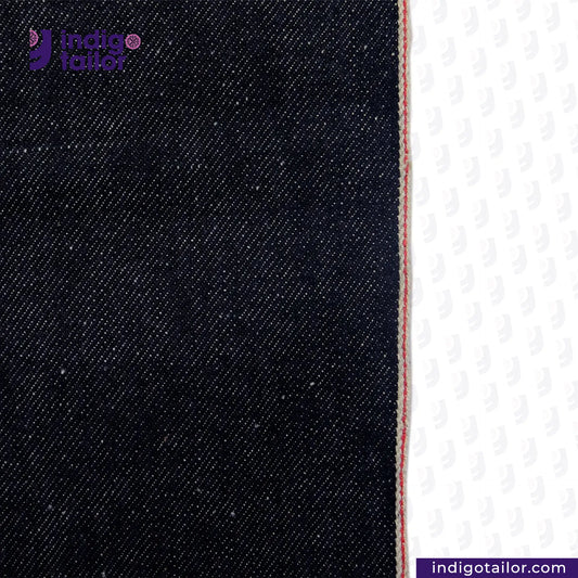 Close-up of SNOWY SELVEDGE DENIM fabric with a white background, featuring the Indigotailor logo.