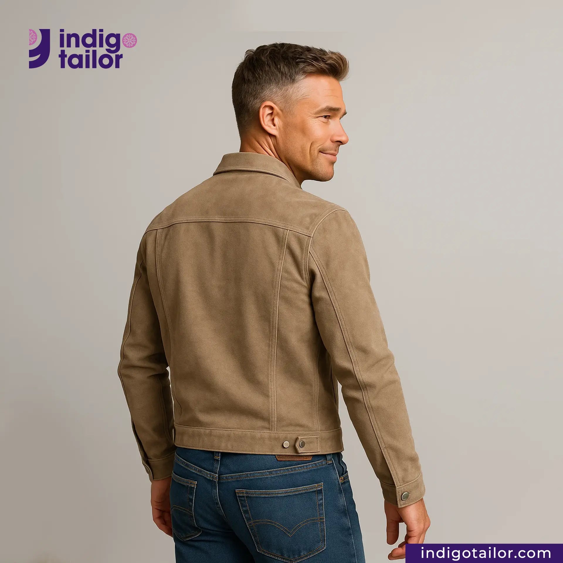 Man wearing a SUEDE JACKET and blue jeans with 'Indigotailor' logo and website on a gray background
