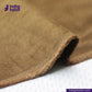 Close-up of brown fabric with 'indigotailor' logo in the corner. TANNED CORDUROY