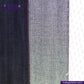 Close-up of TROPIC -CITY- DENIM fabric with a visible brand logo on a white background