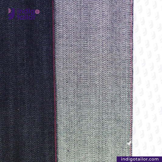 Close-up of TROPIC -CITY- DENIM fabric with a visible brand logo on a white background