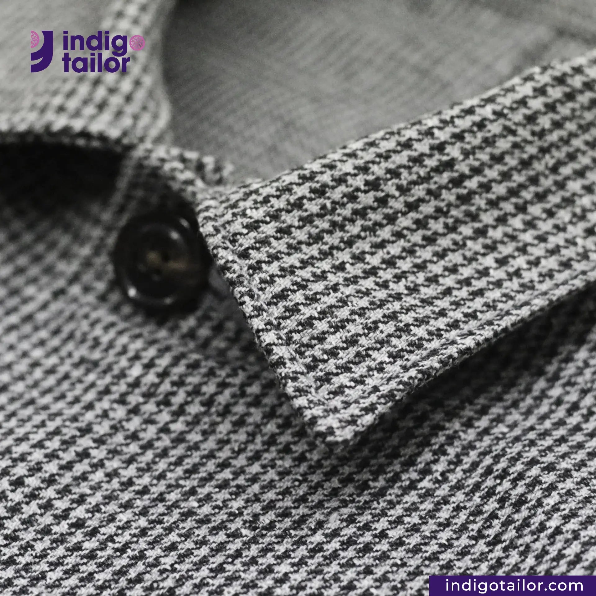 Close-up of a TWEED HOUNDSTOOTH COVERALL JACKET color with a button, featuring the 'indigotailor' brand.