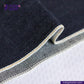 Close-up of TWO TONE SELVEDGE PAPER WEIGHT DENIM fabric with visible stitching on a white background, featuring the Indigotailor logo.
