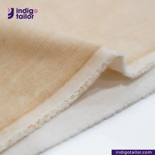 Close-up of VINTAGE CORD fabric with 'Indigo Tailor' logo and website URL.