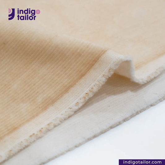 Close-up of VINTAGE CORDUROY fabric with 'indigotailor' logo and website URL.