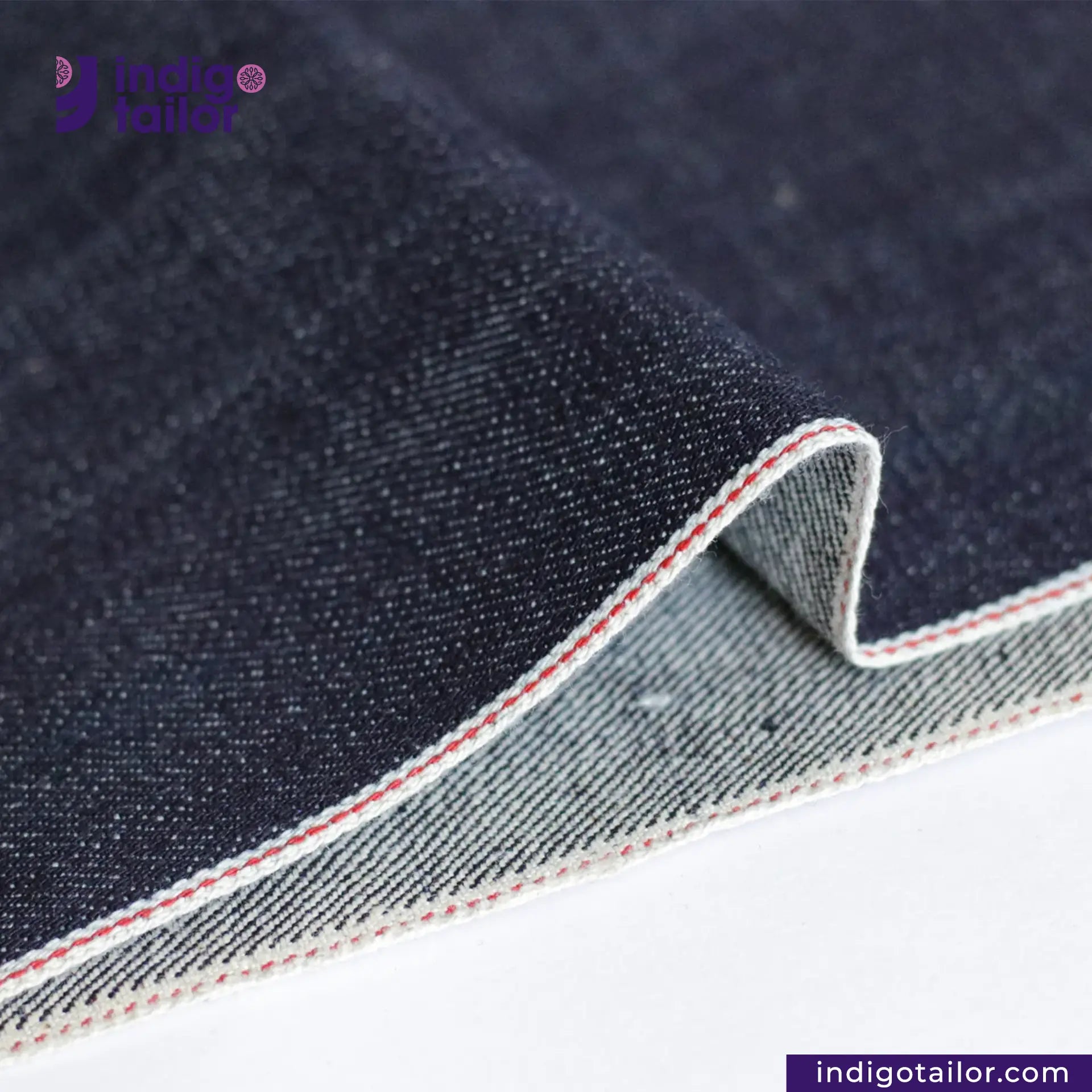 Close-up of VINTAGE SLUB DENIM fabric with a visible brand logo and website.