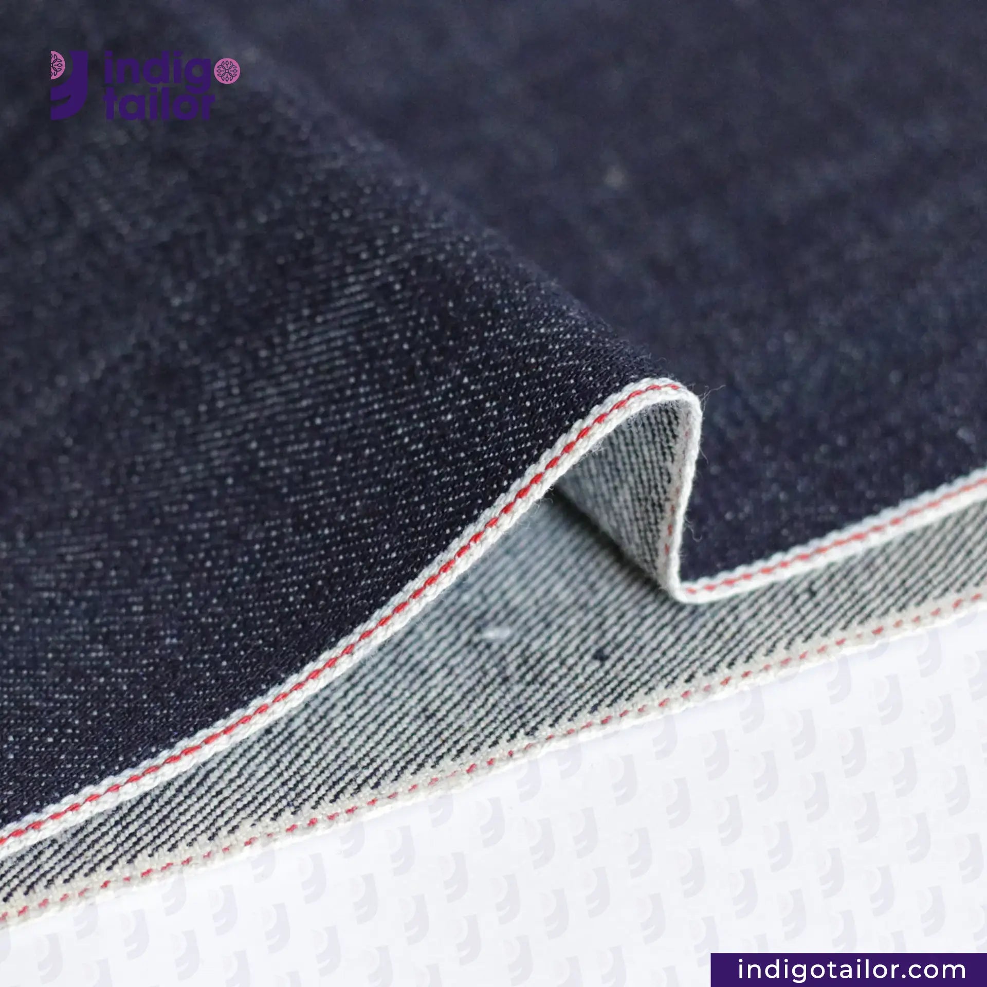 Close-up of VINTAGE SLUB DENIM fabric with a visible brand logo and website.