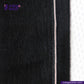 Close-up of WASHED BLACK x BLACK SELVEDGE DENIM fabric with a visible brand logo and website text.