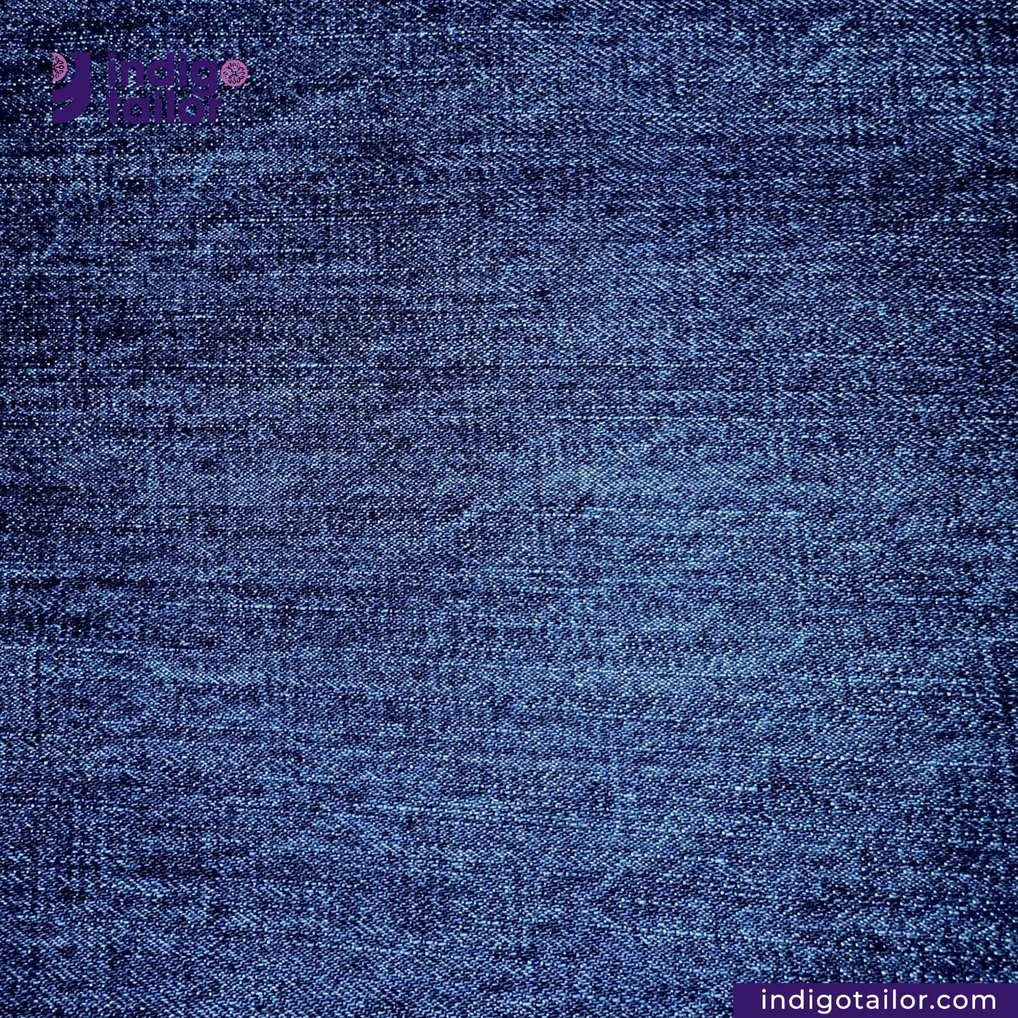 Close-up of WASHED VINTAGE SLUB SELVEDGE DENIM fabric with 'Indigo Tailor' branding.