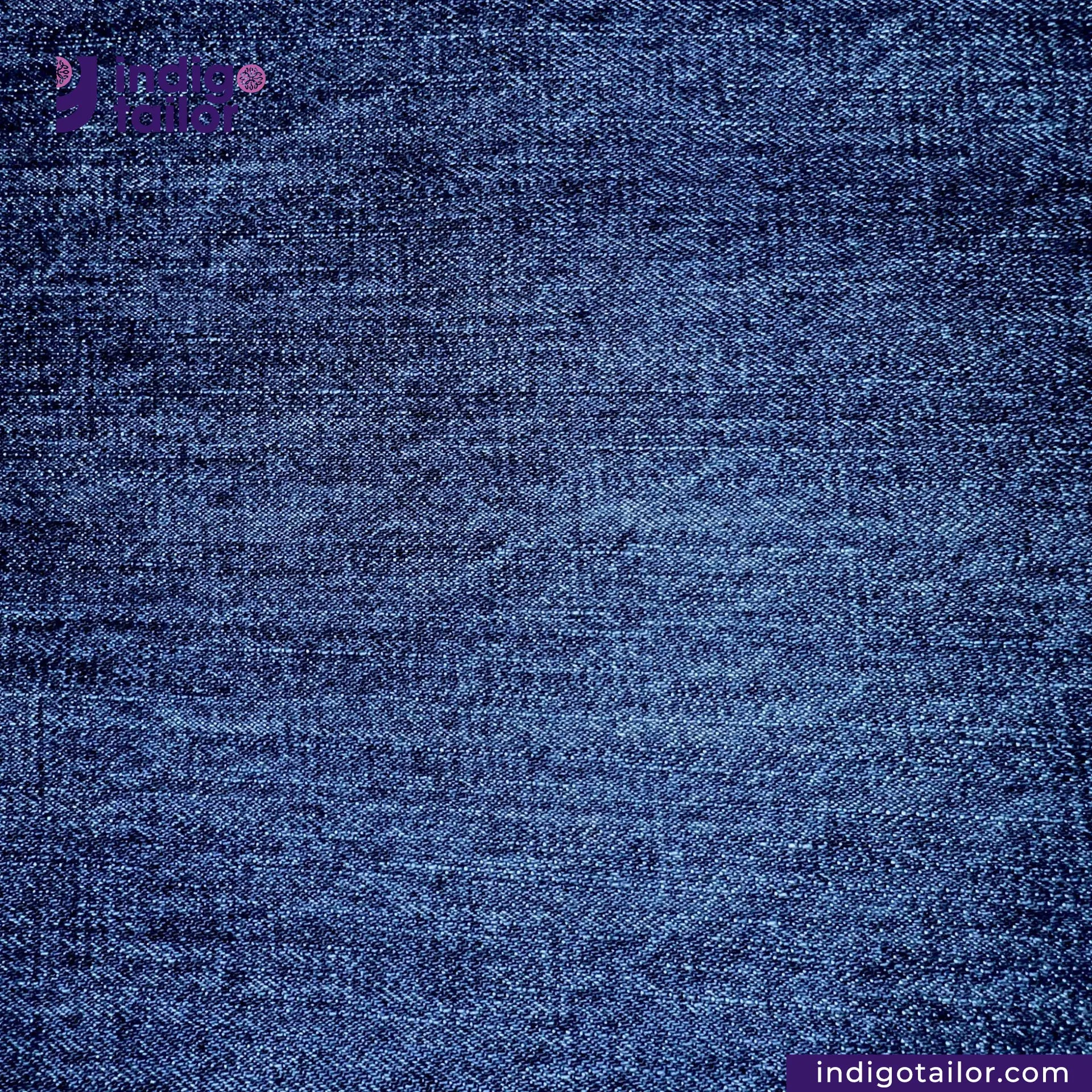 Close-up of WASHED VINTAGE SLUB SELVEDGE DENIM fabric with 'Indigo Tailor' branding.