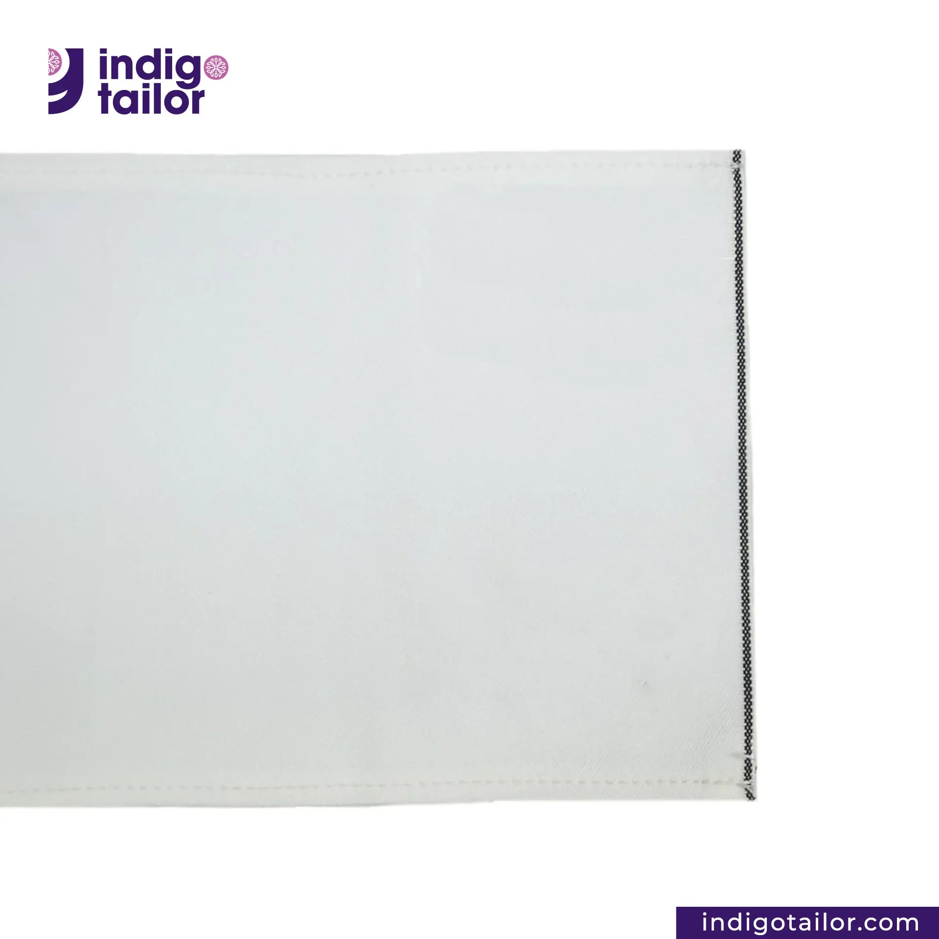 WHITE DENIM BLACK SELVEDGE fabric swatch with a visible seam on a white background, featuring the Indigotailor logo.