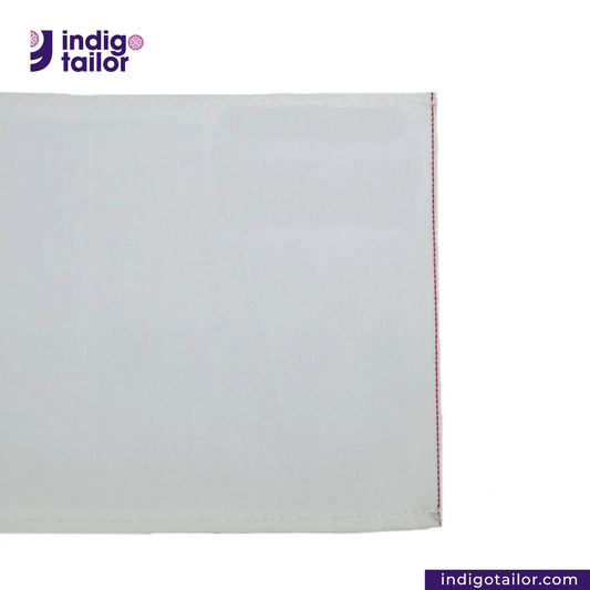 WHITE DENIM DOTTED RED SELVEDGE fabric swatch with a visible brand logo on a white background