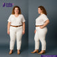 Woman wearing WHITE DENIM RED SELVEDGE and a white shirt with a brown belt, standing against a gray background. Indigotailor logo and website visible.