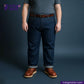 Person wearing WILD INDIGO jeans and brown shoes on a dark background with 'Indigo Tailor' branding.