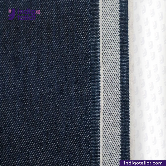 Close-up of WILD INDIGO denim fabric with a brand logo and website text.